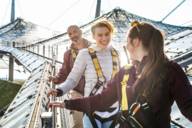 Group of three people on a tent roof tour at the Olympic Stadium and Munich